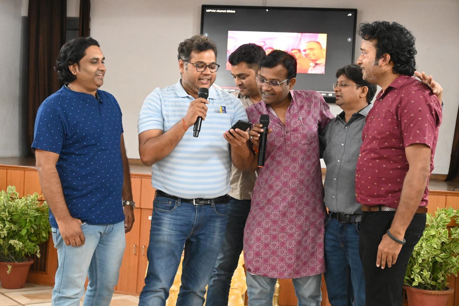 Alumni greeting each other at a previous MPVM alumni meet
